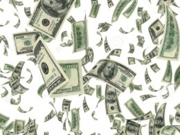 14813842 falling dollar bills on white background