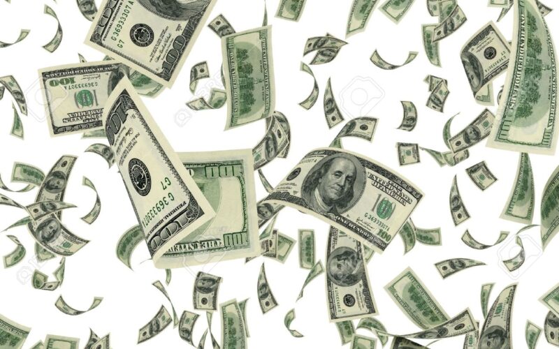 14813842 falling dollar bills on white background